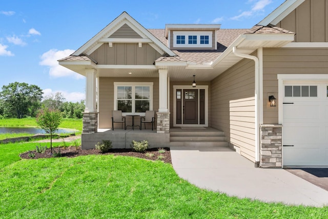 property entrance featuring a yard and covered porch