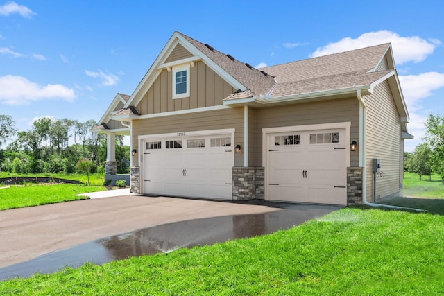 exterior space with a garage and a front lawn