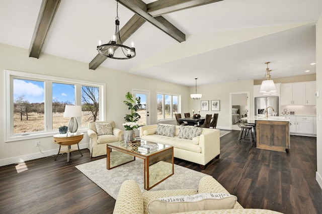 living room with lofted ceiling with beams, dark hardwood / wood-style flooring, and a chandelier