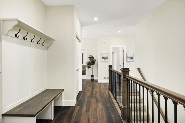 mudroom featuring dark hardwood / wood-style flooring and vaulted ceiling