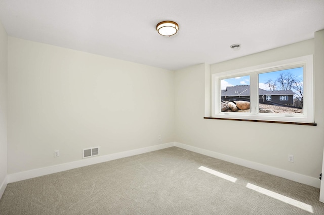 unfurnished room with carpet flooring