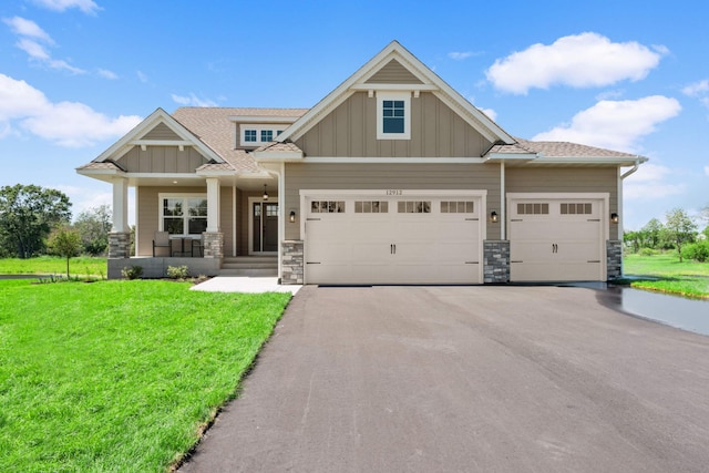 craftsman-style home with a porch and a front lawn