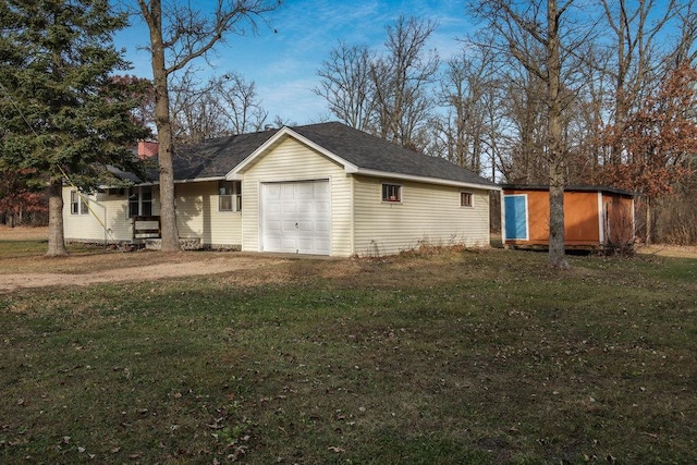 view of side of property featuring a shed and a yard