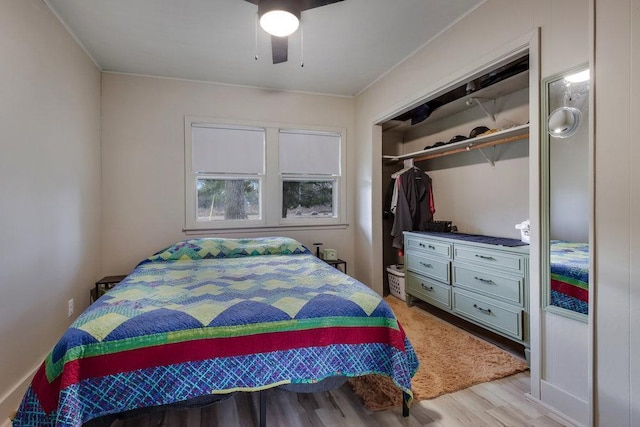 bedroom with a closet, ceiling fan, and light wood-type flooring