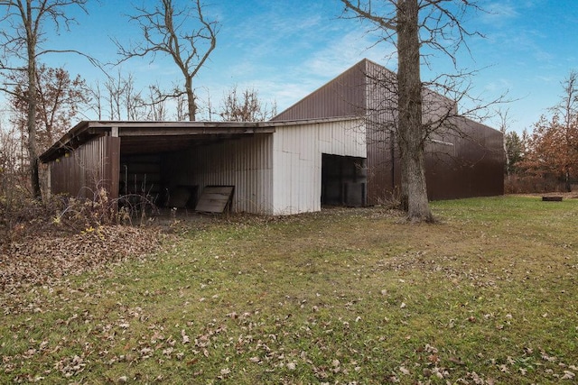 view of outbuilding with a yard