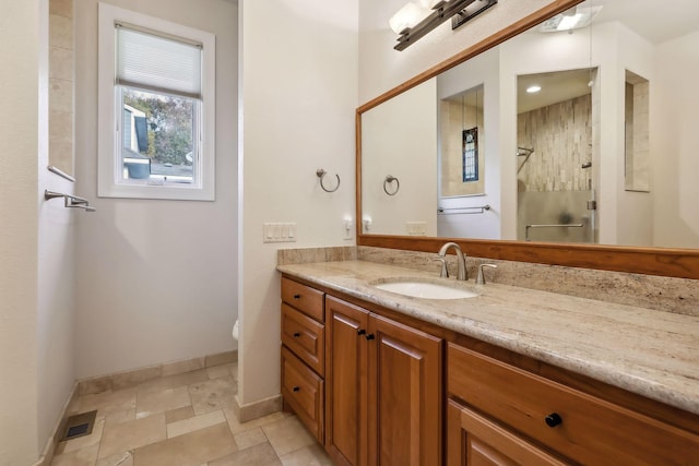 bathroom with vanity and a shower