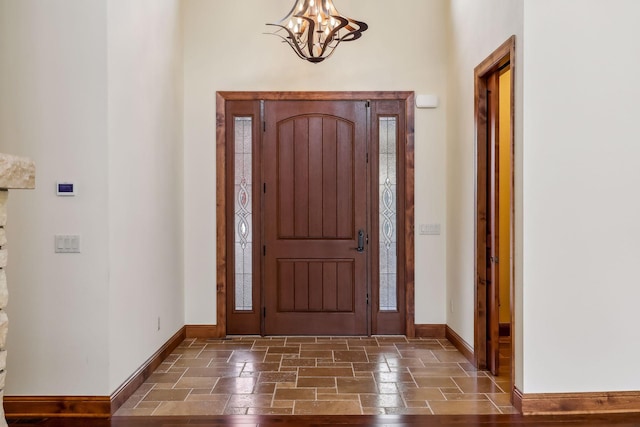 foyer featuring an inviting chandelier