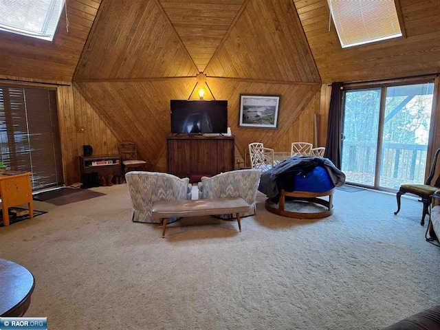 carpeted living room featuring high vaulted ceiling, wooden ceiling, a skylight, and wooden walls