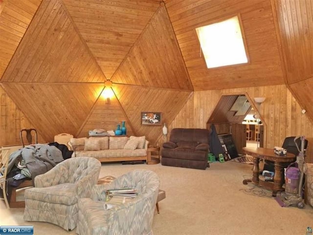 living room with wooden walls, wood ceiling, and carpet flooring