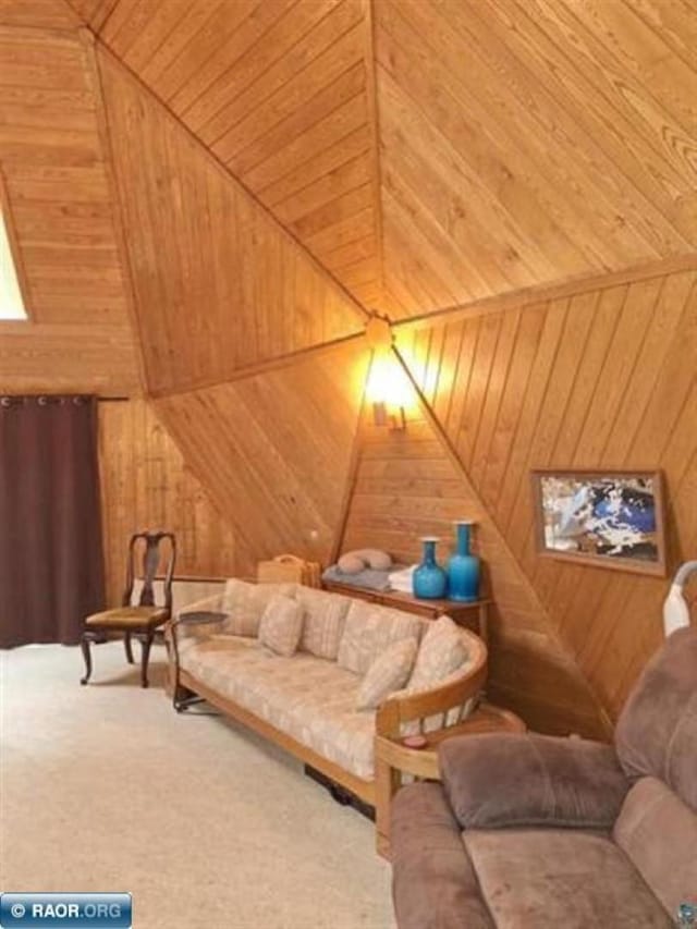 interior space featuring wood walls, carpet flooring, and wood ceiling