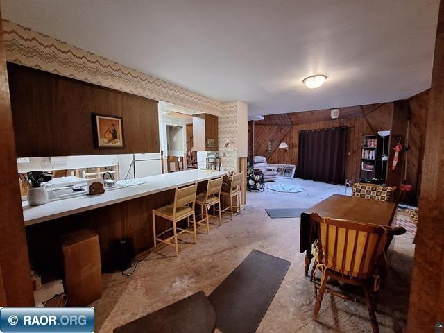 kitchen featuring wooden walls