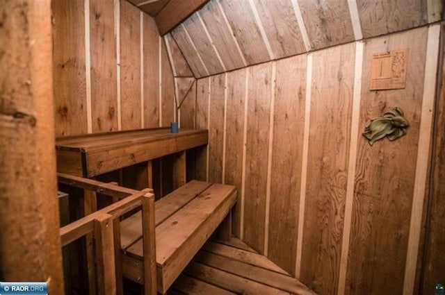 view of sauna / steam room featuring wooden walls