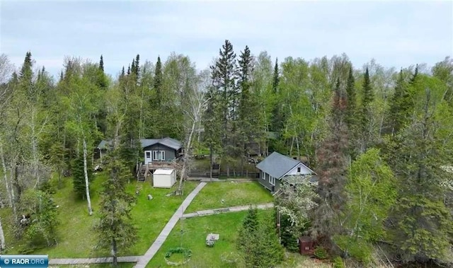 aerial view featuring a wooded view