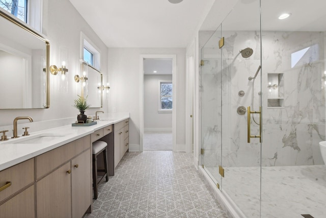 bathroom featuring a shower with door, vanity, and tile patterned flooring