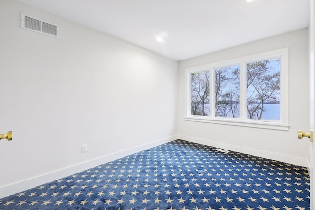 unfurnished room featuring carpet flooring