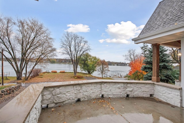 view of patio featuring a water view