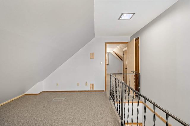 bonus room featuring vaulted ceiling and carpet floors