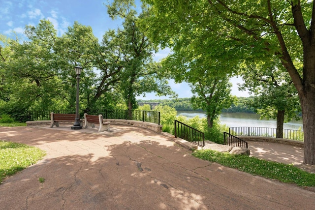 view of patio featuring a water view