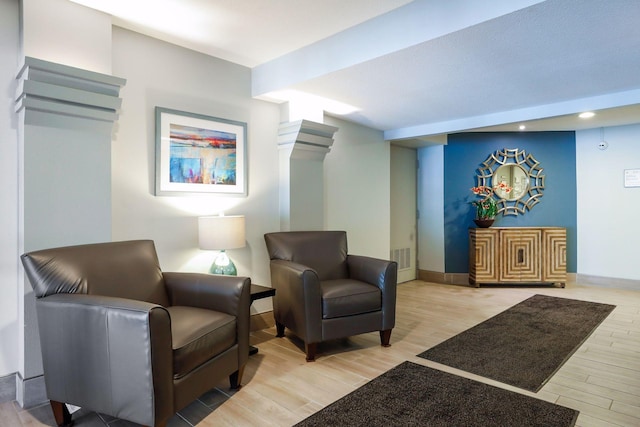 sitting room featuring hardwood / wood-style flooring