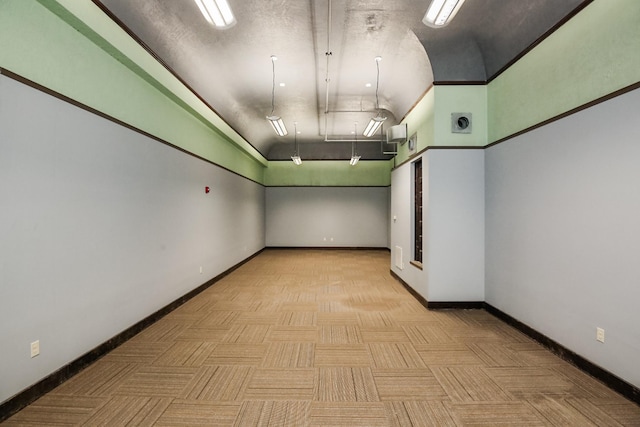 unfurnished room featuring lofted ceiling and light parquet floors