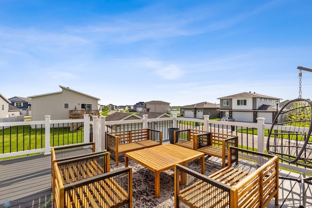 wooden terrace with a yard and an outdoor hangout area