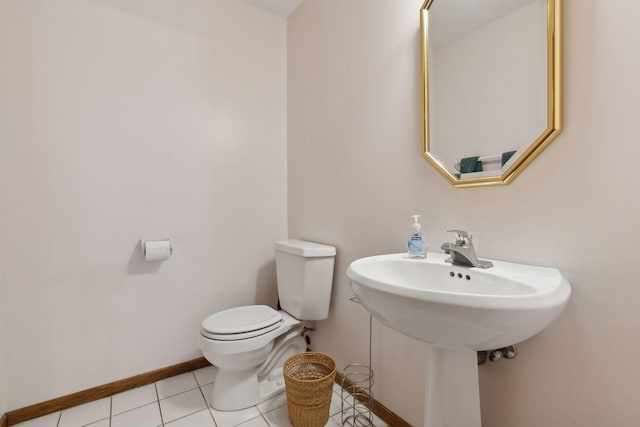 bathroom featuring sink, tile patterned floors, and toilet