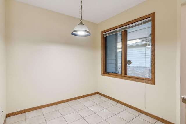 unfurnished room featuring light tile patterned floors