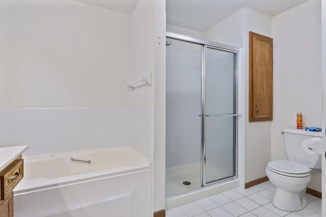 full bathroom with tile patterned flooring, shower with separate bathtub, and a textured ceiling