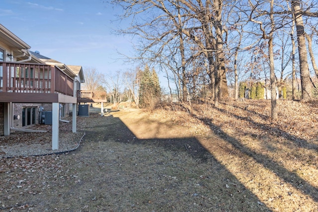 view of yard featuring a wooden deck