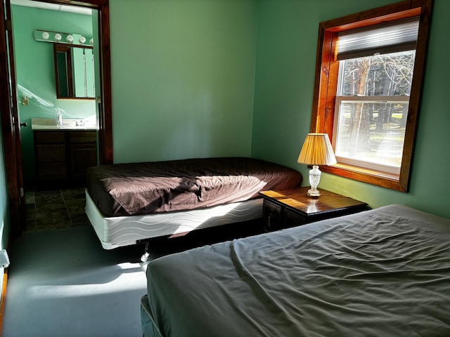 carpeted bedroom with ensuite bathroom