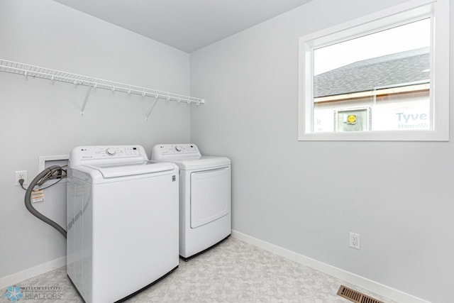 washroom featuring independent washer and dryer