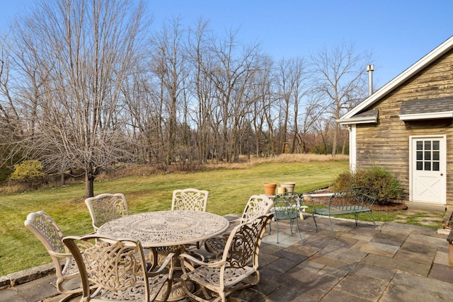 view of patio / terrace with outdoor dining space and an outdoor structure