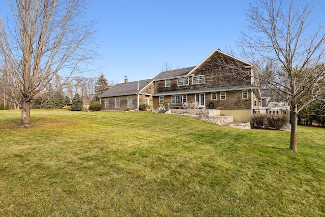 exterior space with a chimney and a yard