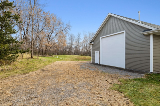 detached garage featuring driveway