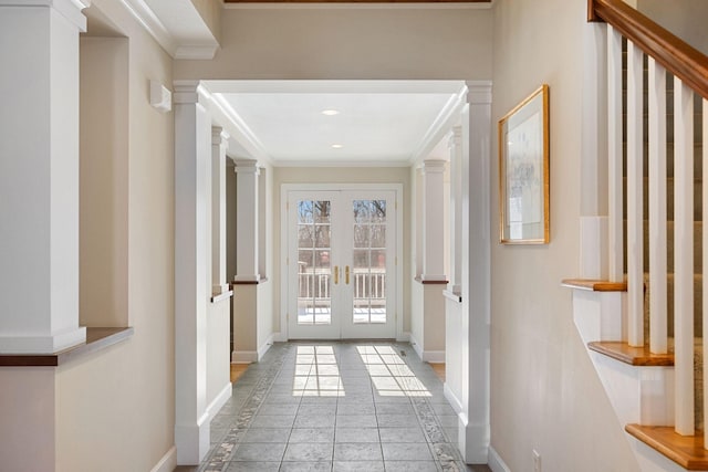 doorway to outside with baseboards, french doors, decorative columns, and crown molding