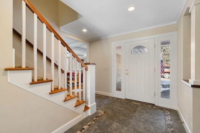 entryway featuring baseboards, crown molding, stairs, and recessed lighting