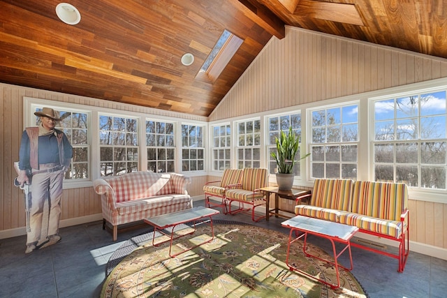 sunroom with vaulted ceiling with skylight, wood ceiling, and plenty of natural light