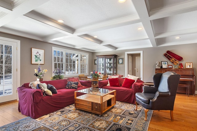 living room with beam ceiling, coffered ceiling, and hardwood / wood-style flooring