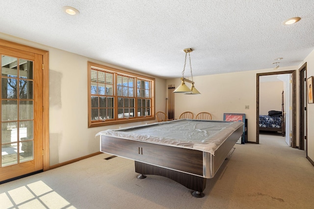 game room featuring light carpet, baseboards, and a wealth of natural light