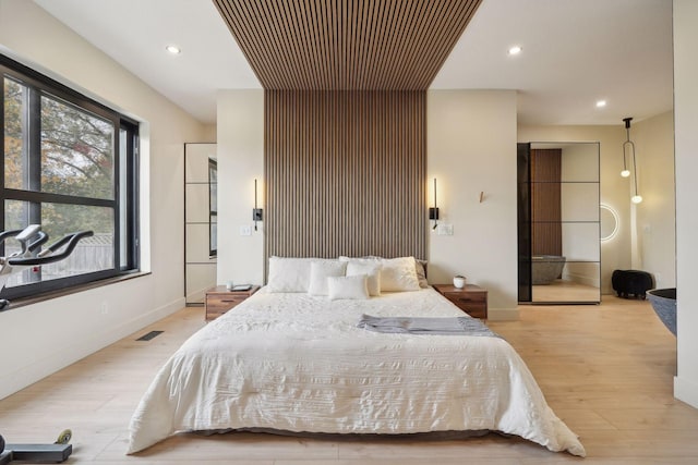 bedroom with light hardwood / wood-style flooring