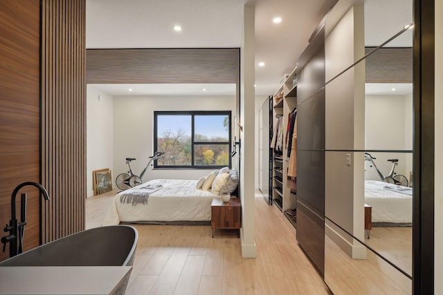 bedroom with light hardwood / wood-style floors