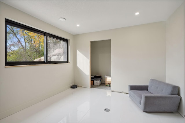 living area with light tile patterned floors