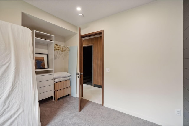 carpeted bedroom with a closet