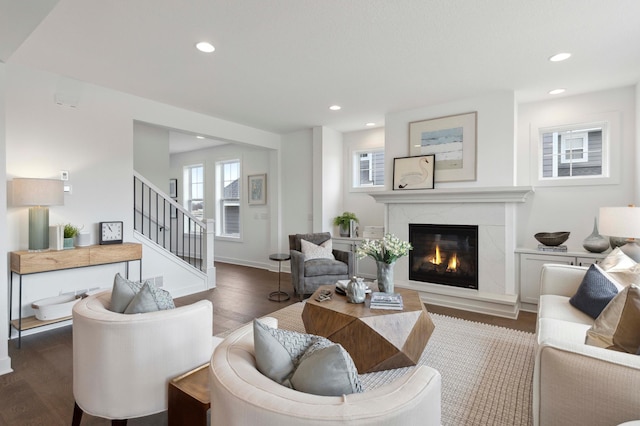 living room with dark hardwood / wood-style floors and a fireplace