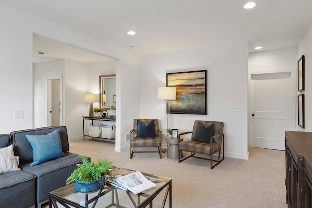 living room featuring light carpet