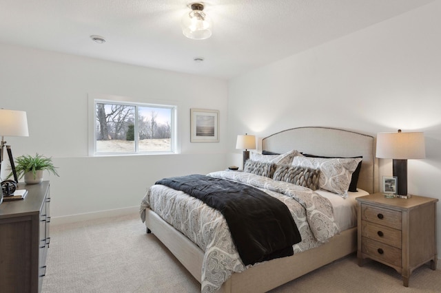 bedroom featuring light colored carpet