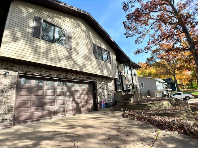 view of property exterior with a garage