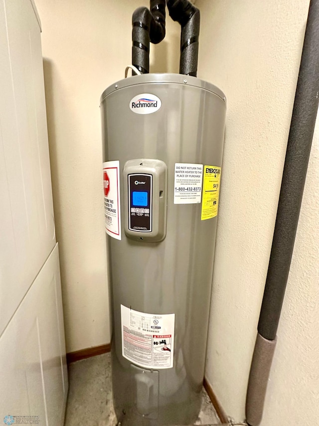 utility room featuring electric water heater