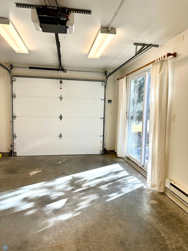 garage with a garage door opener and a baseboard radiator