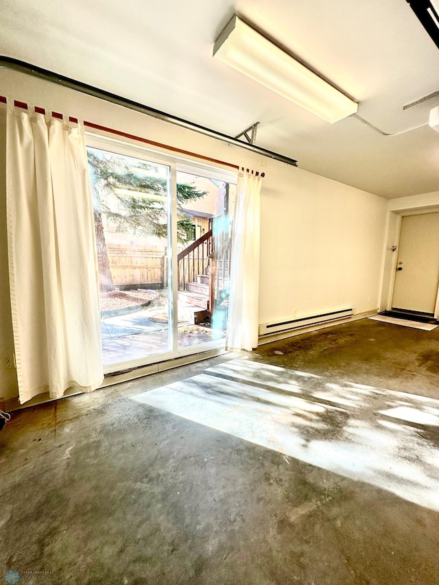 garage featuring baseboard heating